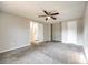 Neutral bedroom featuring carpet, a ceiling fan, and natural light at 4901 Smokehollow Rd, Charlotte, NC 28227