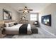 Relaxing main bedroom featuring a ceiling fan, stylish furnishings, and ample natural light at 4901 Smokehollow Rd, Charlotte, NC 28227