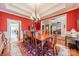 Elegant dining room with hardwood floors, chandelier, and views into adjacent rooms at 5218 Shadow Pond Ln, Charlotte, NC 28226