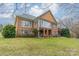 Brick house exterior with sunroom and deck at 5218 Shadow Pond Ln, Charlotte, NC 28226