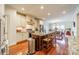 Spacious kitchen with granite island, stainless steel appliances, and hardwood floors at 5218 Shadow Pond Ln, Charlotte, NC 28226