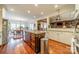 Large kitchen with island, stainless steel appliances, and hardwood floors at 5218 Shadow Pond Ln, Charlotte, NC 28226