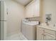 Convenient laundry room with washer, dryer, and storage at 5218 Shadow Pond Ln, Charlotte, NC 28226