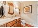 Elegant powder room with marble vanity and hardwood floors at 5218 Shadow Pond Ln, Charlotte, NC 28226