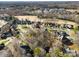 Neighborhood aerial view showing houses and landscape at 5428 Old Course Dr, Cramerton, NC 28032