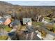 Aerial view of a neighborhood with houses and trees at 5428 Old Course Dr, Cramerton, NC 28032