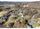 Aerial view of neighborhood with houses and trees at 5428 Old Course Dr, Cramerton, NC 28032