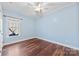 Bedroom with hardwood floors and window at 5428 Old Course Dr, Cramerton, NC 28032