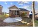 Back exterior view of house with screened porch and patio at 5428 Old Course Dr, Cramerton, NC 28032