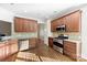 Eat-in kitchen featuring stainless steel appliances and ample cabinetry at 5428 Old Course Dr, Cramerton, NC 28032