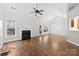 Spacious living room with hardwood floors and fireplace at 5428 Old Course Dr, Cramerton, NC 28032