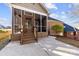 Brick screened porch with steps leading to a patio at 5428 Old Course Dr, Cramerton, NC 28032