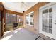 Relaxing screened porch with brick flooring and ceiling fan at 5428 Old Course Dr, Cramerton, NC 28032