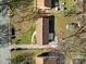 An aerial shot showcasing a house's roofline, yard, and neighboring properties at 624 Gaywood Dr, Charlotte, NC 28273