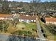 Aerial view of a single-Gathering home with a well-maintained lawn and driveway at 624 Gaywood Dr, Charlotte, NC 28273