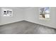 Simple bedroom with gray flooring and large window at 624 Gaywood Dr, Charlotte, NC 28273