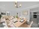 Modern dining area with light wood table and seating at 624 Gaywood Dr, Charlotte, NC 28273