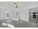 Sunlit dining room with gray flooring and kitchen access at 624 Gaywood Dr, Charlotte, NC 28273