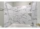 Clean bathroom with marble-tiled shower/tub combo at 6325 Windsor Gate Ln, Charlotte, NC 28215