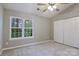 Spacious bedroom with double closets and ceiling fan at 6325 Windsor Gate Ln, Charlotte, NC 28215