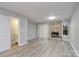 Living room with stone fireplace, sliding glass doors, and hardwood floors at 6325 Windsor Gate Ln, Charlotte, NC 28215