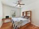 Cozy bedroom with a double bed, built-in shelves, and hardwood floors at 8839 Blooming Arbor St, Huntersville, NC 28078