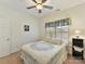 Bright bedroom with double bed, ceiling fan, and window with blinds at 8839 Blooming Arbor St, Huntersville, NC 28078