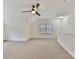 Spacious bonus room with ceiling fan and neutral carpeting at 8839 Blooming Arbor St, Huntersville, NC 28078