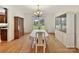 Formal dining room featuring hardwood floors and a view of the backyard at 8839 Blooming Arbor St, Huntersville, NC 28078