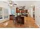 Kitchen with island, hardwood floors, and stainless steel appliances at 8839 Blooming Arbor St, Huntersville, NC 28078