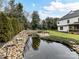 Peaceful koi pond with many fish at 8839 Blooming Arbor St, Huntersville, NC 28078