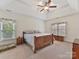 Spacious main bedroom with tray ceiling and hardwood floors at 8839 Blooming Arbor St, Huntersville, NC 28078