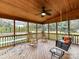 Relaxing screened porch with rocking chairs and a porch swing at 8839 Blooming Arbor St, Huntersville, NC 28078