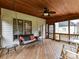 Relaxing screened porch with swing and ceiling fan at 8839 Blooming Arbor St, Huntersville, NC 28078