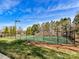 Well-maintained tennis courts with surrounding fence at 8839 Blooming Arbor St, Huntersville, NC 28078