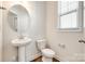 Clean bathroom with pedestal sink and oval mirror at 919 Emma Kate Ct, Lake Wylie, SC 29710