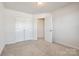 Well-lit bedroom featuring double doors and carpet at 919 Emma Kate Ct, Lake Wylie, SC 29710