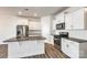 Modern kitchen with white cabinets, granite countertops, and stainless steel appliances at 919 Emma Kate Ct, Lake Wylie, SC 29710