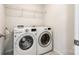 Laundry room with washer and dryer, and overhead shelving at 919 Emma Kate Ct, Lake Wylie, SC 29710