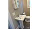 Updated bathroom with pedestal sink and toilet at 924 E Main St, Albemarle, NC 28001