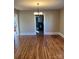 Bright dining room with hardwood floors and chandelier, view into kitchen at 924 E Main St, Albemarle, NC 28001