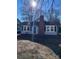 Gray house with blue shutters, brick chimney, and a partially visible front yard at 924 E Main St, Albemarle, NC 28001