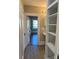 Hallway with built-in shelving and view into another room at 924 E Main St, Albemarle, NC 28001