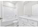 Bathroom with a shower-tub combo and white vanity with chrome finishes at 9307 Dufaux Dr, Charlotte, NC 28278