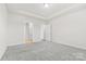 Bright bedroom featuring neutral walls, carpeted floor, and recessed lighting at 9307 Dufaux Dr, Charlotte, NC 28278