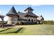 Exterior of community clubhouse with stone facade and unique turret design at 9307 Dufaux Dr, Charlotte, NC 28278