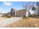 Charming one-story home with a two-car garage and manicured landscaping at 9307 Dufaux Dr, Charlotte, NC 28278