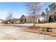 Front exterior of a one-story home featuring a 2-car garage, sidewalk, and driveway at 9307 Dufaux Dr, Charlotte, NC 28278