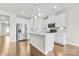 Contemporary kitchen with white cabinetry, stainless steel appliances, tile backsplash, and pendant lighting at 9307 Dufaux Dr, Charlotte, NC 28278