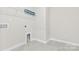 Convenient laundry room with built-in shelving at 9307 Dufaux Dr, Charlotte, NC 28278